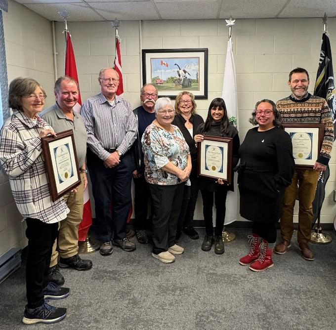 People holding an award